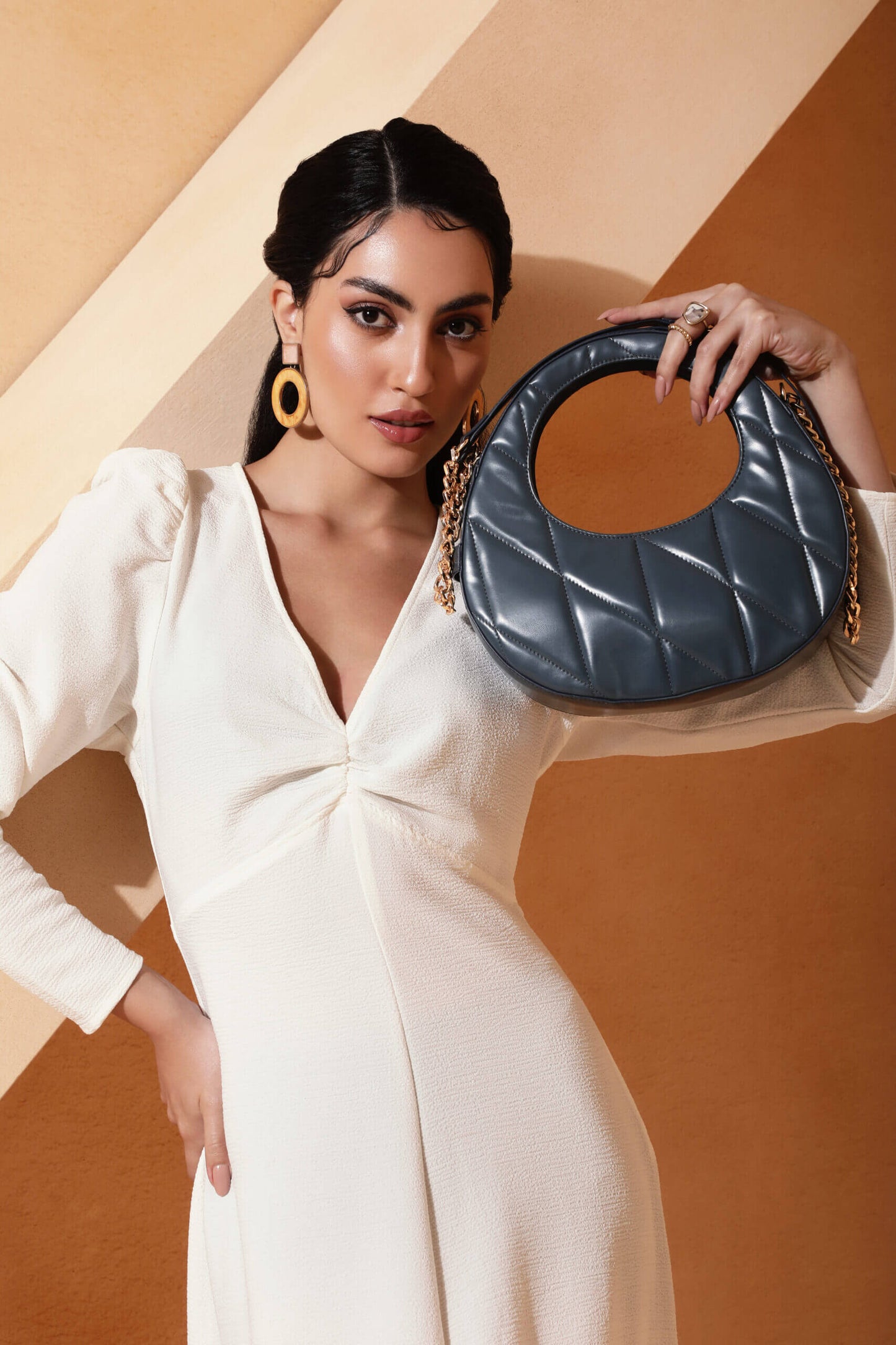 Poetry quilted shoulder bag