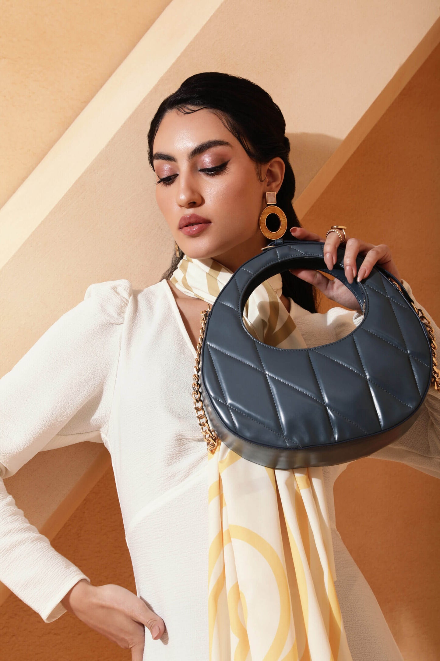 Poetry quilted shoulder bag